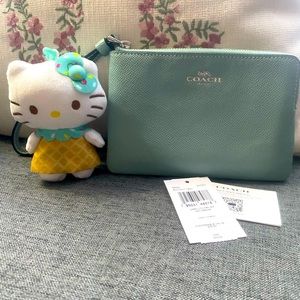 Light Teal Coach Wristlet with Hello Kitty Waffle Cone Plush Dangler